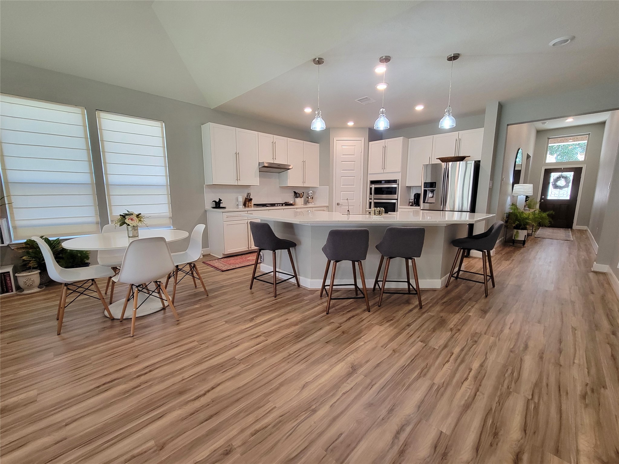 2095 Parnevik Place Conroe, TX 77304 - Photo 9 of 23 Low-maintenance LVP flooring runs throughout the living areas.