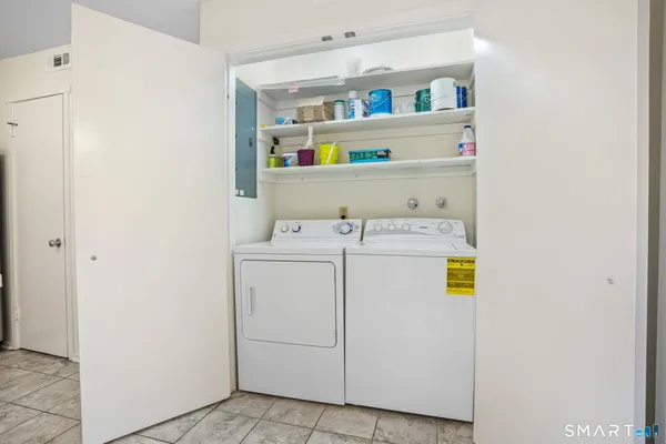 a utility room with dryer and washer