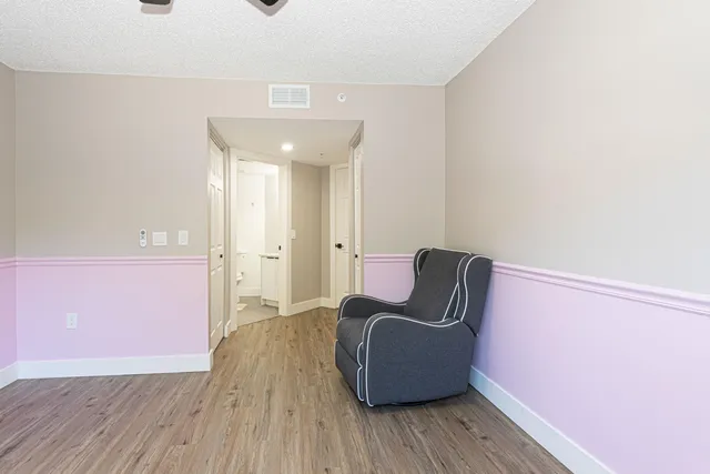 a view of chair and wooden floor