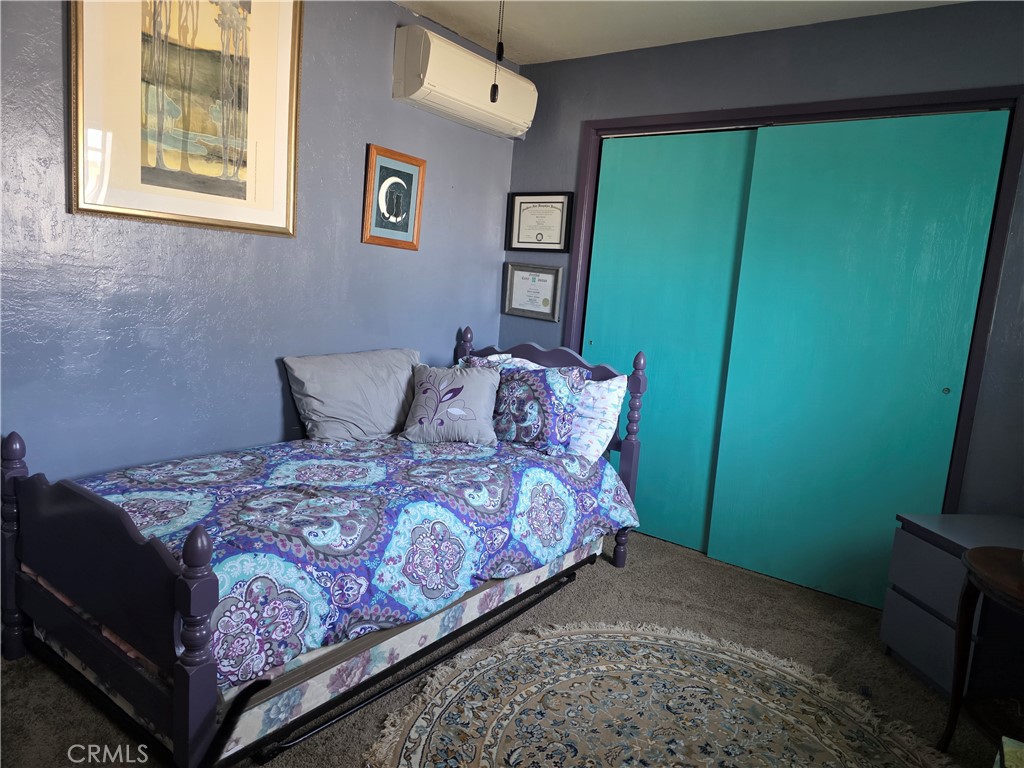 16061 Dam Road Clearlake, CA 95422 - Photo 15 of 37 a bedroom with a bed and a window