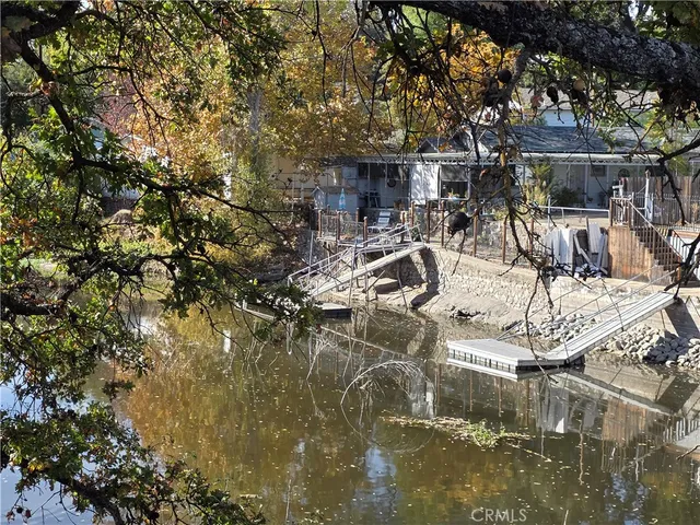 a view of a chair and tables in the patio