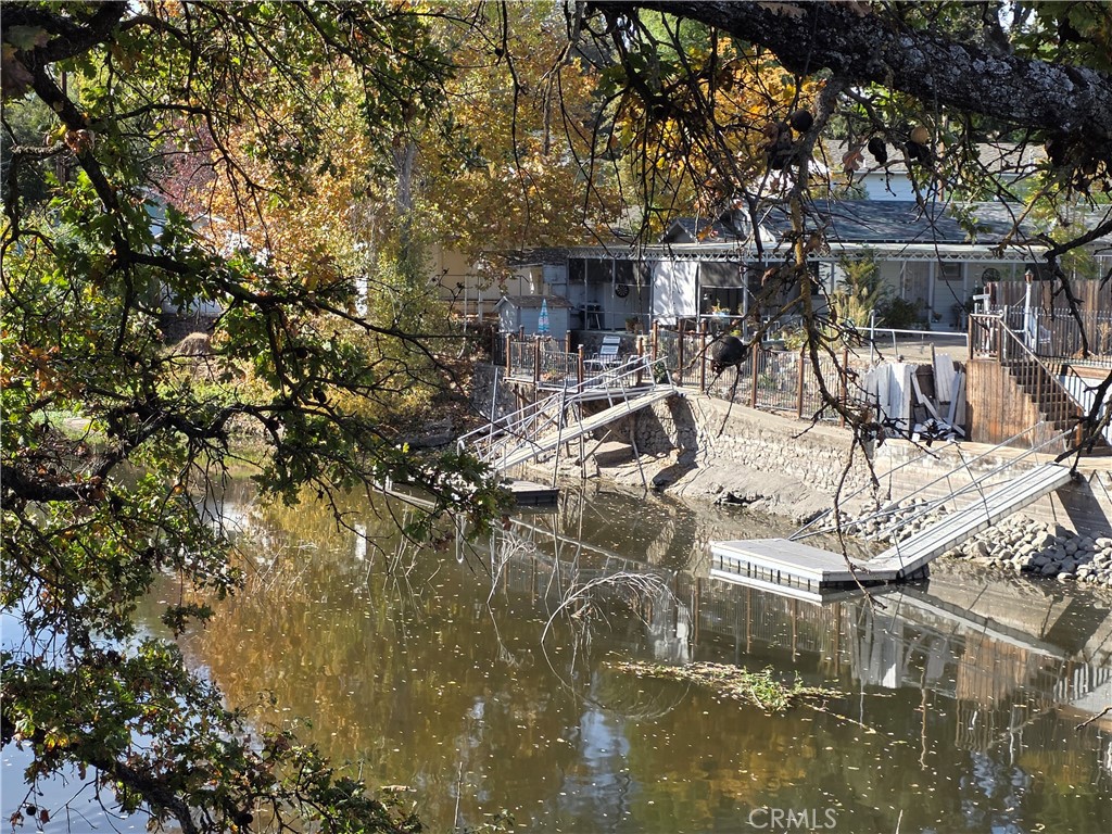 16061 Dam Road Clearlake, CA 95422 - Photo 25 of 37 a view of a swimming pool with outdoor seating and plants
