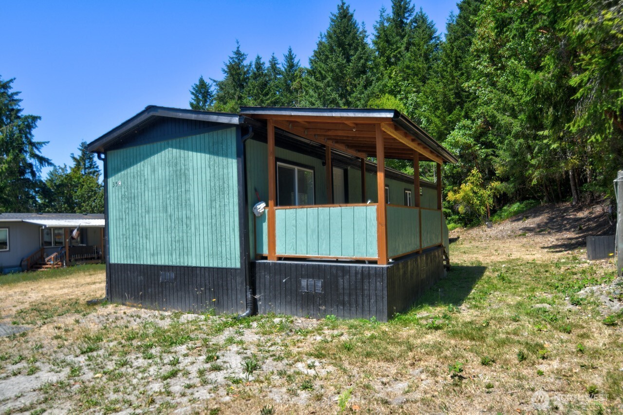 15503 Cedar Park Road Southeast, Unit 35C Olalla, WA 98359 - Photo 11 of 13 a view of a backyard with a garden