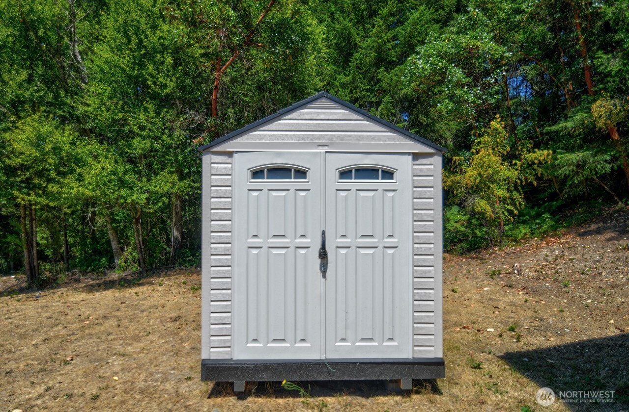 15503 Cedar Park Road Southeast, Unit 35C Olalla, WA 98359 - Photo 10 of 13 a view of a house with a yard