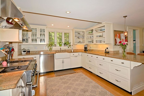 28 Sears Road Wayland, MA 01778 - Photo 12 of 30 a large white kitchen with cabinets and chairs