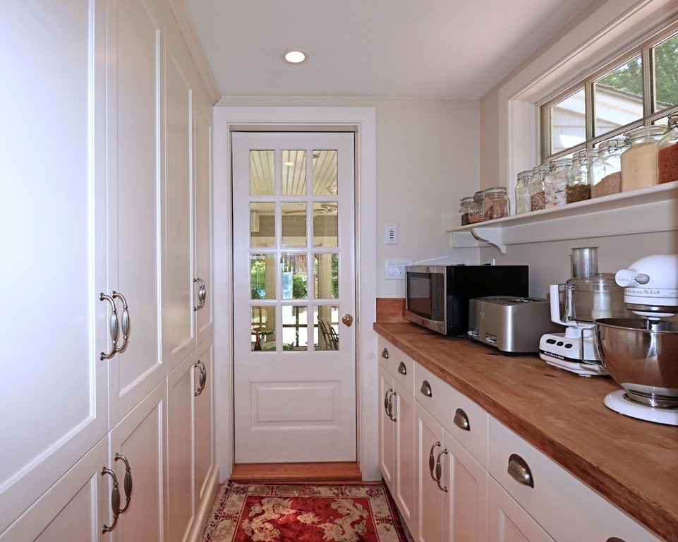 28 Sears Road Wayland, MA 01778 - Photo 15 of 30 a kitchen with granite countertop a refrigerator and a sink