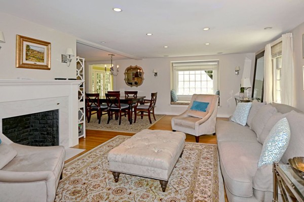 28 Sears Road Wayland, MA 01778 - Photo 18 of 30 a living room with furniture a large window and a fireplace