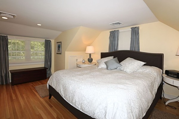 28 Sears Road Wayland, MA 01778 - Photo 21 of 30 a bedroom with a bed and a large window