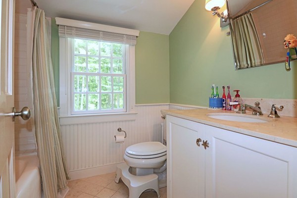 28 Sears Road Wayland, MA 01778 - Photo 23 of 30 a bathroom with a toilet sink vanity granite and shower