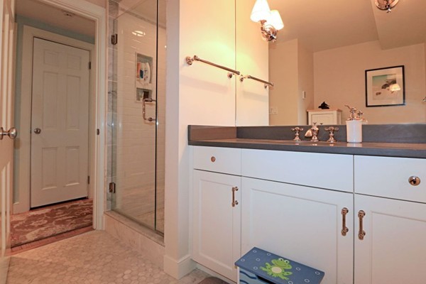 28 Sears Road Wayland, MA 01778 - Photo 24 of 30 a bathroom with a sink and a mirror
