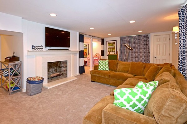28 Sears Road Wayland, MA 01778 - Photo 27 of 30 a living room with furniture and a fireplace