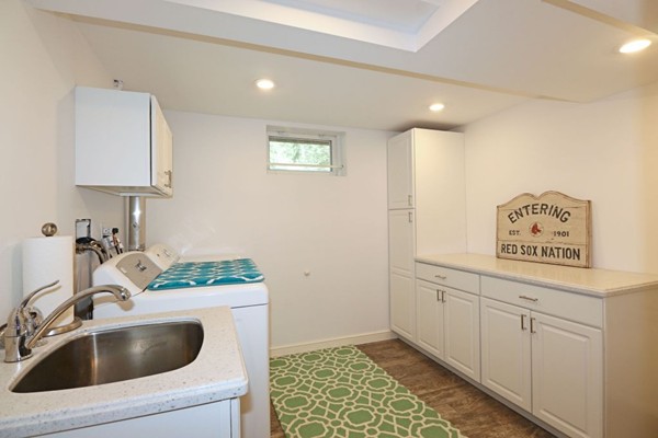 28 Sears Road Wayland, MA 01778 - Photo 28 of 30 a bathroom with a sink a toilet and mirror