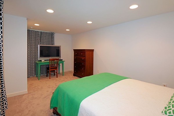 28 Sears Road Wayland, MA 01778 - Photo 30 of 30 a bedroom with a bed and a chair