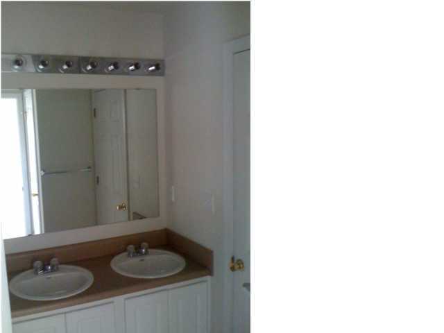 208 Limestone Circle Crestview, FL 32539 - Photo 18 of 20 a bathroom with a sink and a mirror