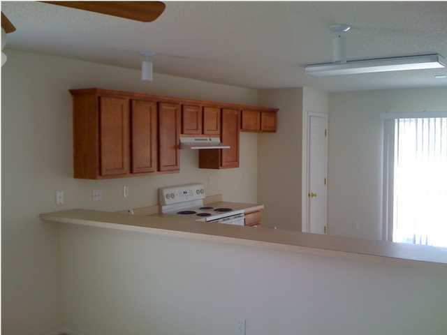 208 Limestone Circle Crestview, FL 32539 - Photo 5 of 20 a kitchen with stainless steel appliances granite countertop a sink stove and cabinets