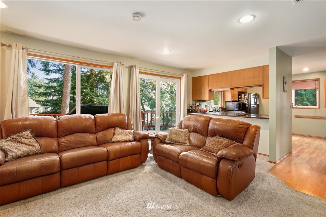 5030 Northeast 21st Street Renton, WA 98059 - Photo 9 of 27 a living room with furniture and large windows