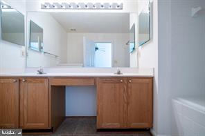 6348 Dakine Circle Springfield, VA 22150 - Photo 14 of 35 a bathroom with a sink and a mirror
