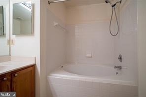 6348 Dakine Circle Springfield, VA 22150 - Photo 15 of 35 a bathroom with a bath tub with a shower