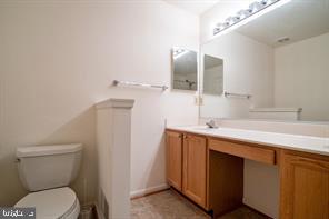 6348 Dakine Circle Springfield, VA 22150 - Photo 16 of 35 a bathroom with a sink and mirror