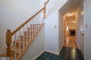 6348 Dakine Circle Springfield, VA 22150 - Photo 2 of 35 a view of a hallway with wooden floor and staircase