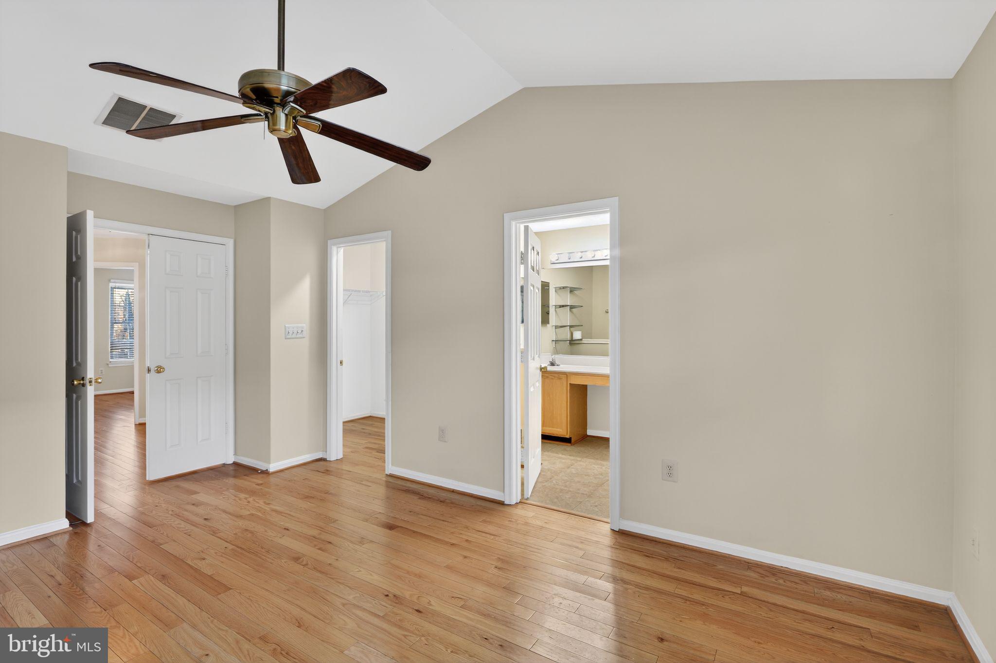 6348 Dakine Circle Springfield, VA 22150 - Photo 23 of 35 a view of empty room with wooden floor and ceiling fan