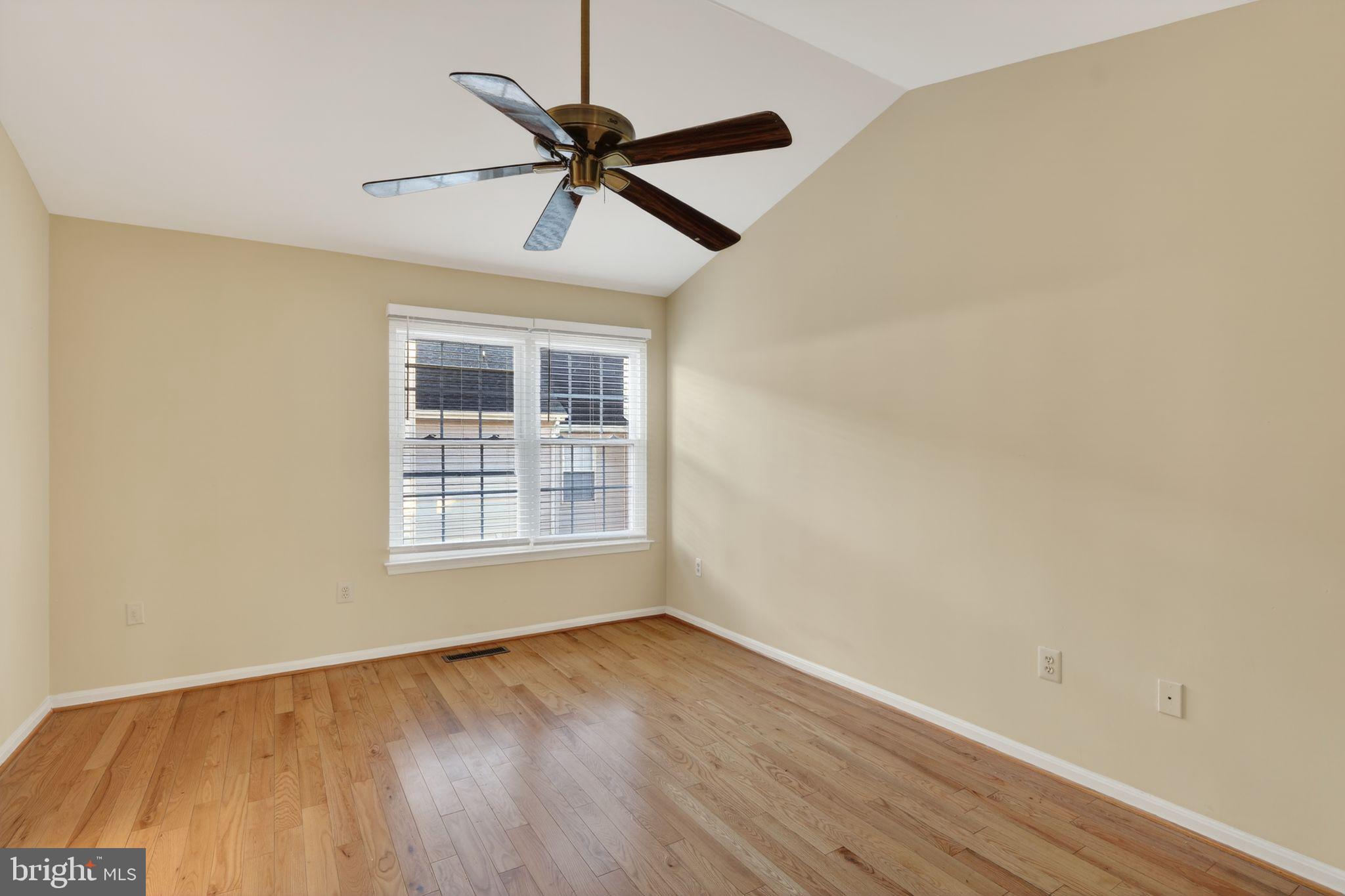 6348 Dakine Circle Springfield, VA 22150 - Photo 25 of 35 a view of an empty room with wooden floor and a window