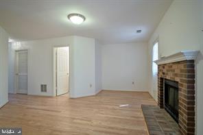 6348 Dakine Circle Springfield, VA 22150 - Photo 27 of 35 an empty room with a fireplace