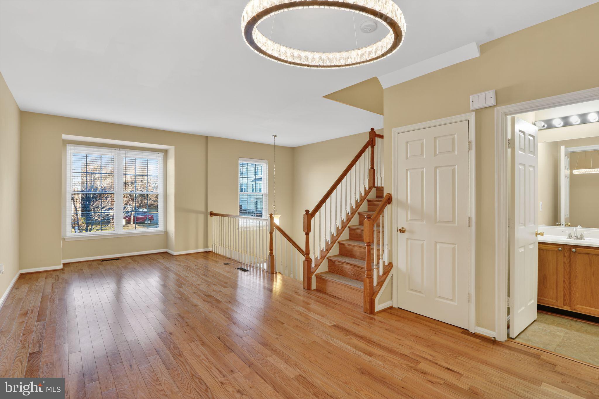 6348 Dakine Circle Springfield, VA 22150 - Photo 3 of 35 a view of an empty room with wooden floor and a window