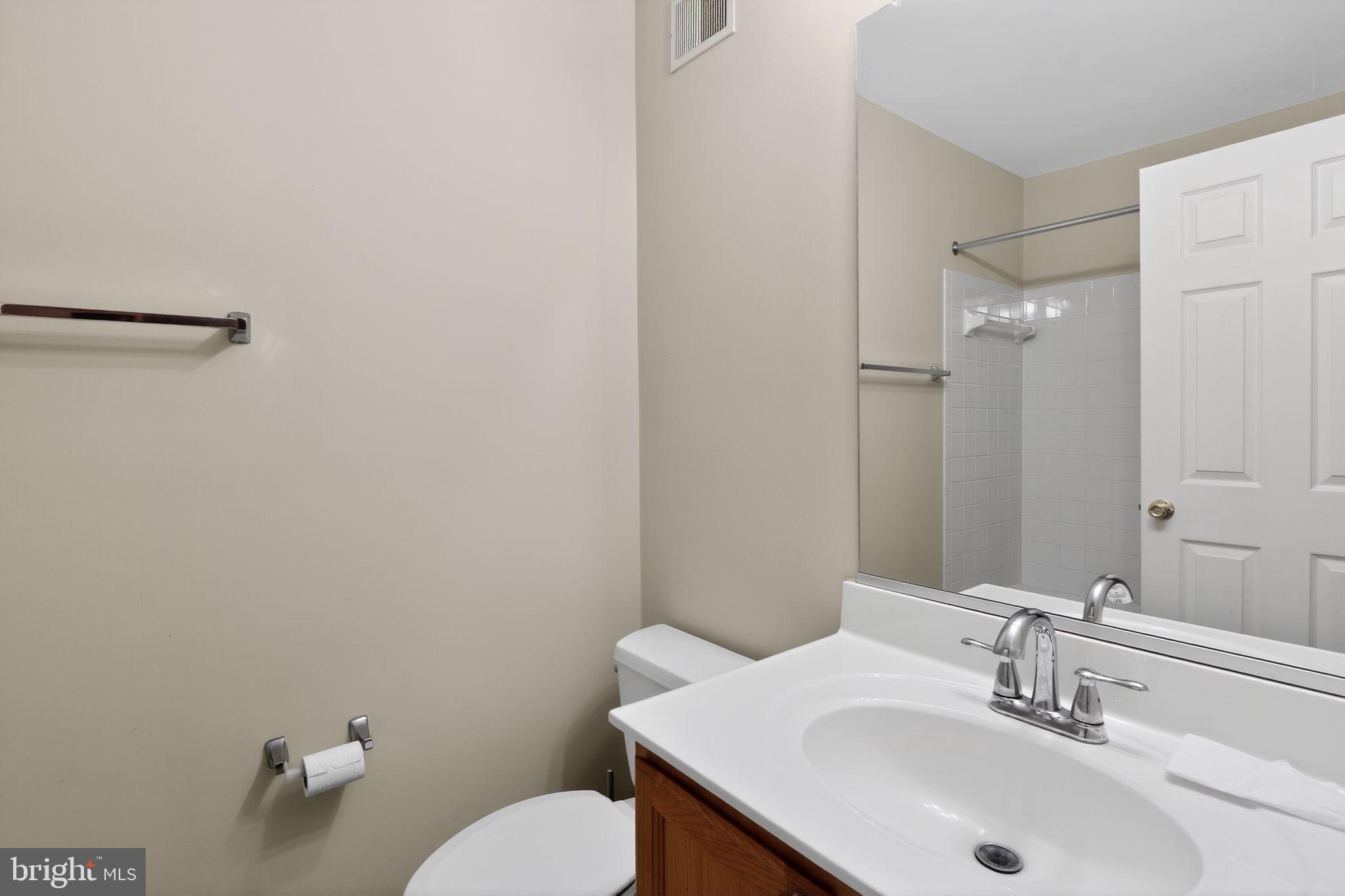 6348 Dakine Circle Springfield, VA 22150 - Photo 32 of 35 a bathroom with a sink toilet and a mirror