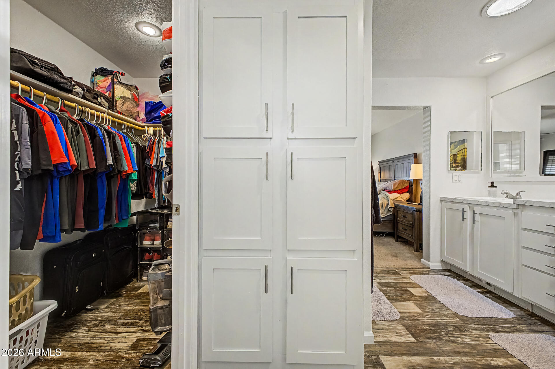 22417 West Dove Valley Road Wittmann, AZ 85361 - Photo 21 of 53 a view of walk in closet with clothes and shoes