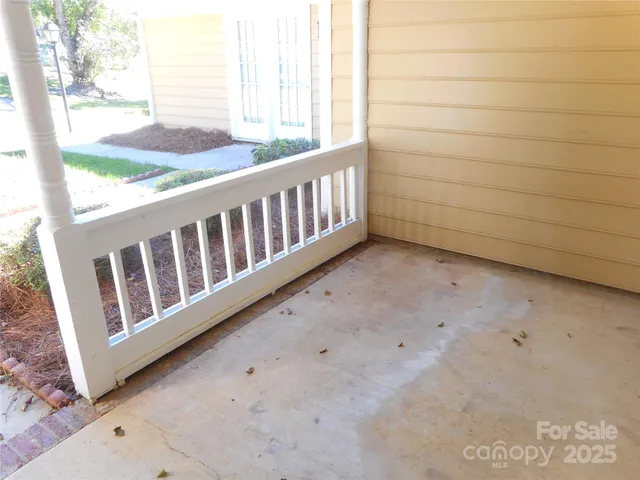 a view of a wooden house with a small yard