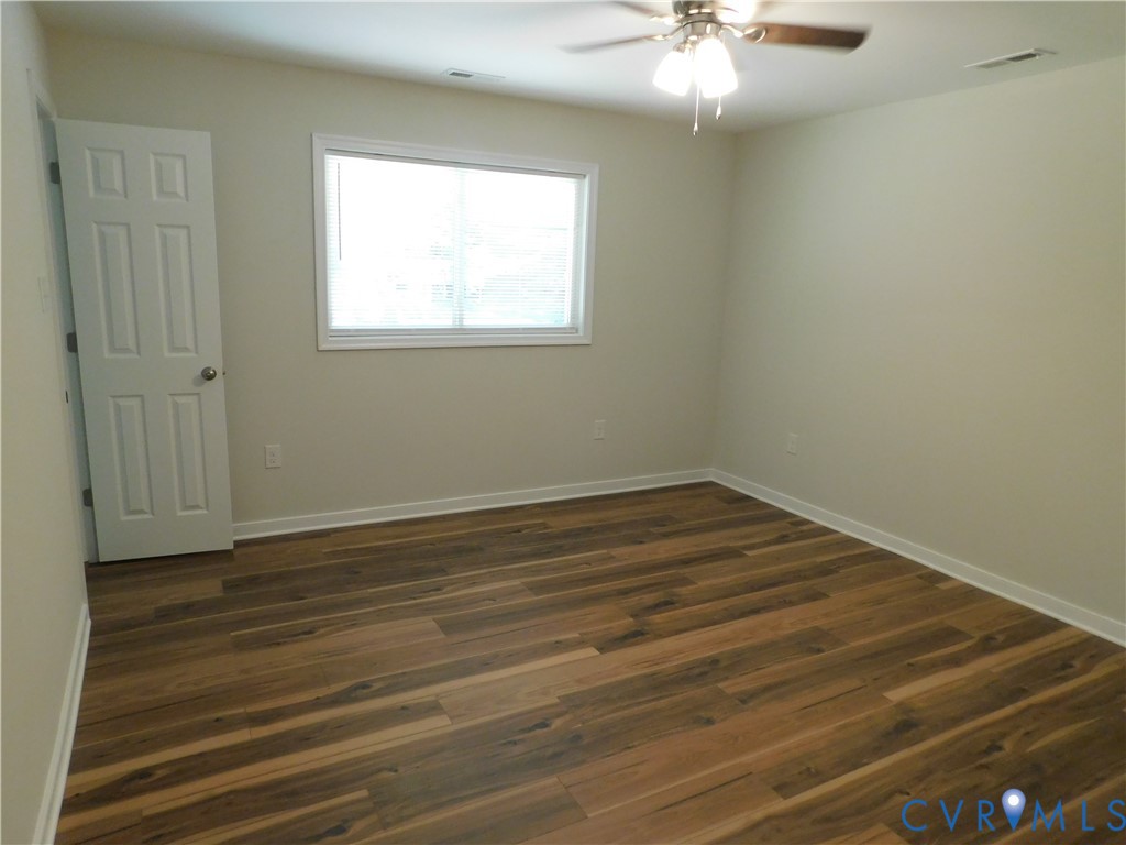 5322 Adams Road Quinton, VA 23141 - Photo 49 of 56 Wood-finish flooring, neutral wall tones, and a ce
