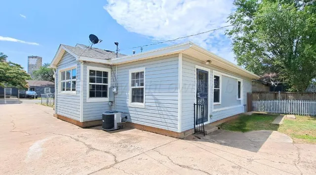 a view of large house with a outdoor space