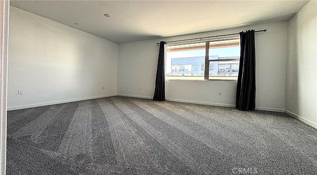 612 East Carson Street, Unit 303 Carson, CA 90745 - Photo 18 of 51 an empty room with a window