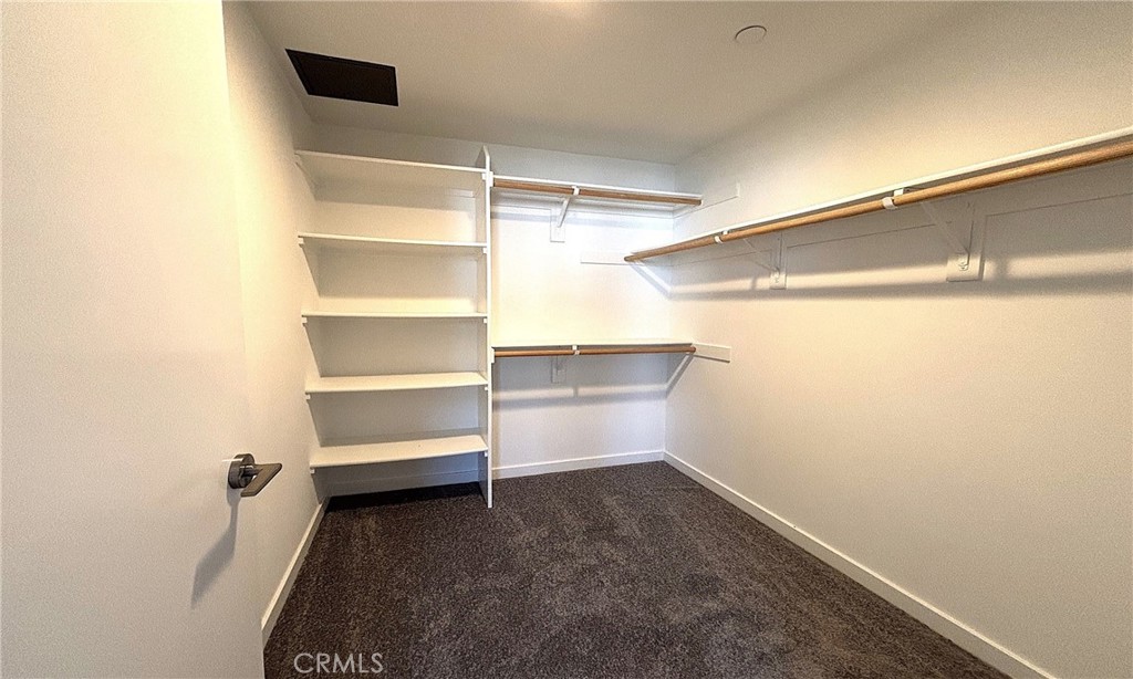 612 East Carson Street, Unit 303 Carson, CA 90745 - Photo 23 of 51 a storage room with empty racks