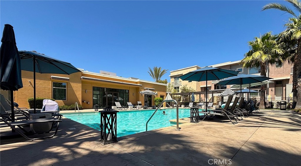 612 East Carson Street, Unit 303 Carson, CA 90745 - Photo 29 of 51 a view of a chairs and table in patio with a barbeque grill