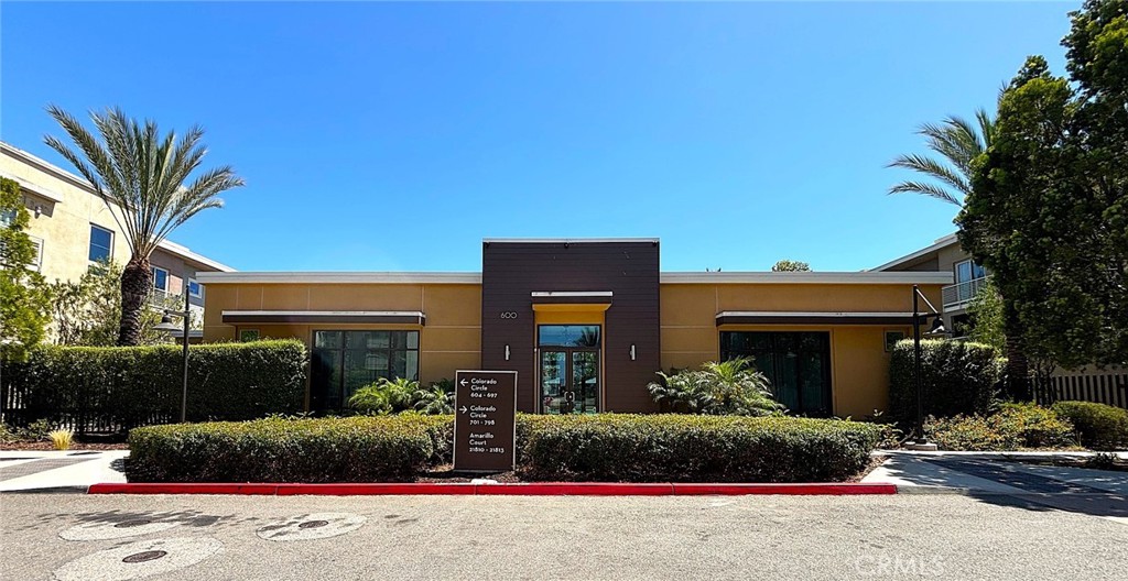 612 East Carson Street, Unit 303 Carson, CA 90745 - Photo 3 of 51 a front view of a house with a yard