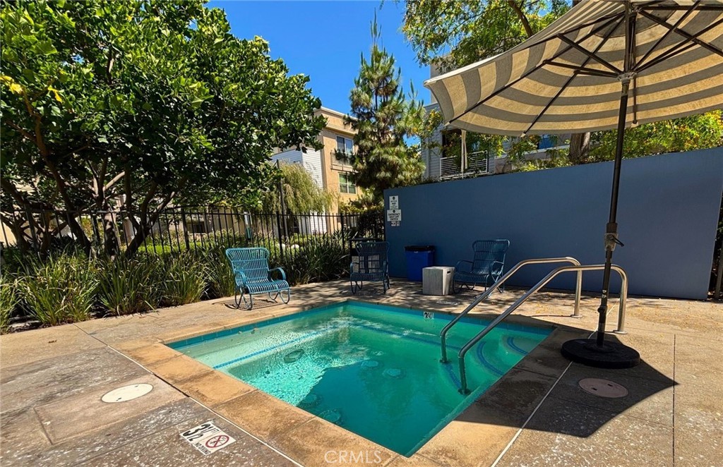 612 East Carson Street, Unit 303 Carson, CA 90745 - Photo 31 of 51 a backyard of a house with seating space