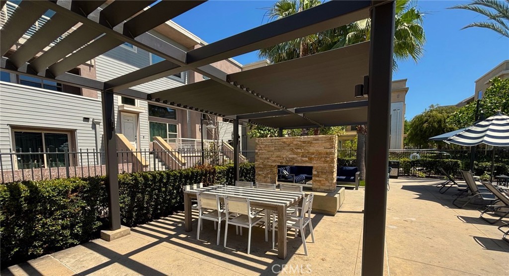 612 East Carson Street, Unit 303 Carson, CA 90745 - Photo 35 of 51 a view of a patio with table and chairs potted plants