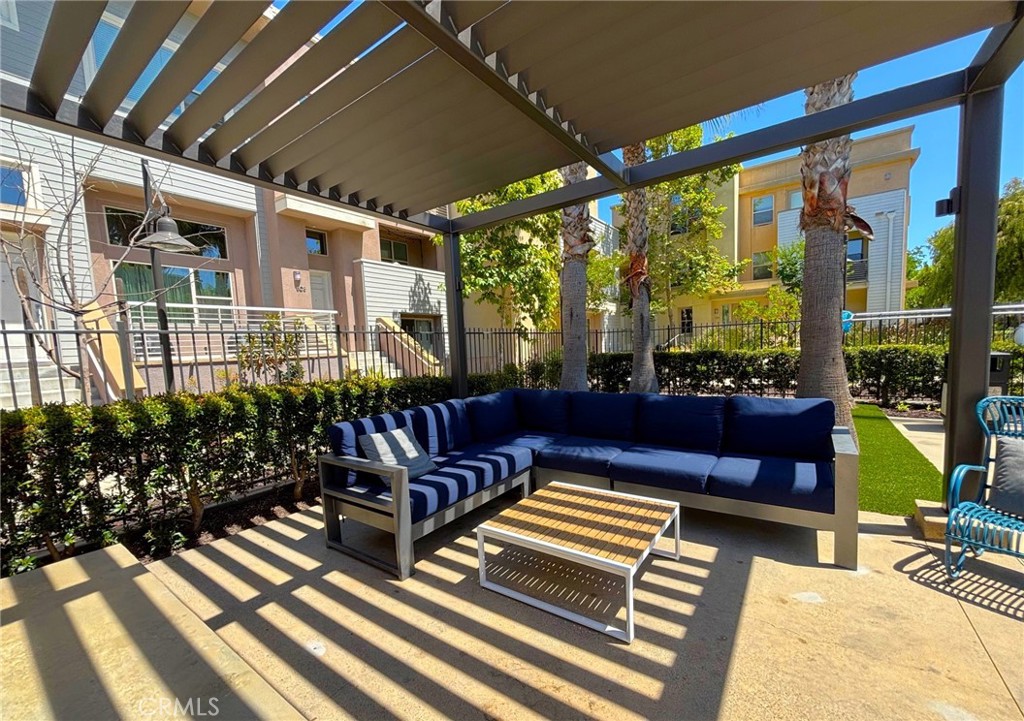 612 East Carson Street, Unit 303 Carson, CA 90745 - Photo 36 of 51 a view of a chairs and tables in the patio