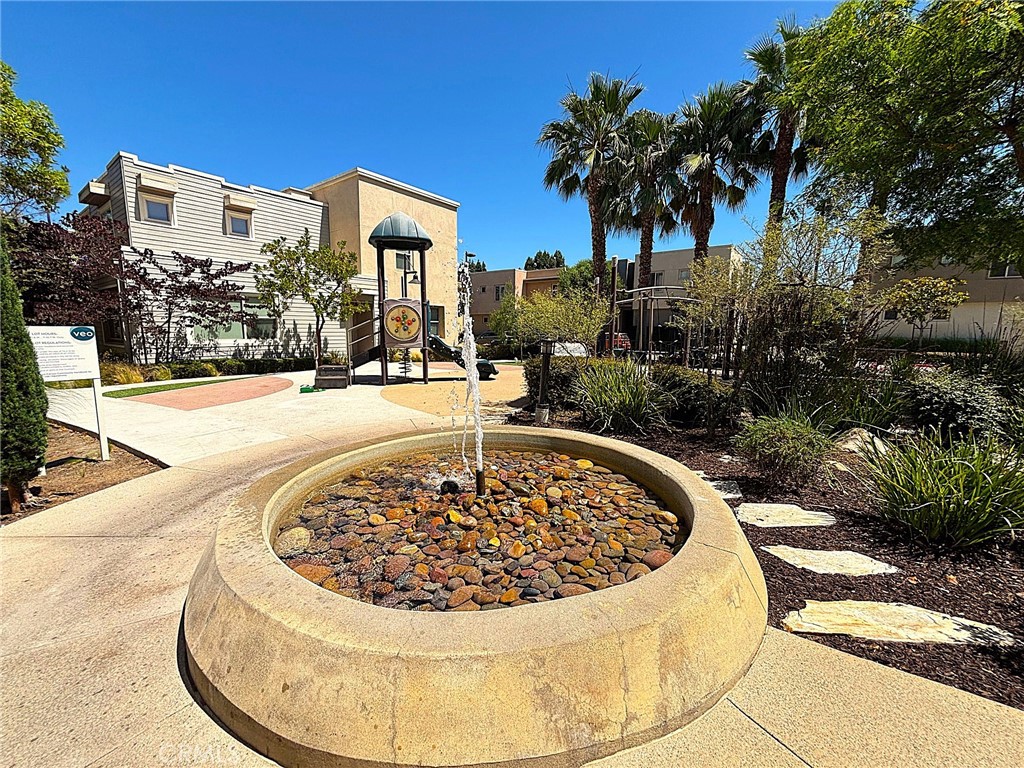 612 East Carson Street, Unit 303 Carson, CA 90745 - Photo 39 of 51 a view of a swimming pool with a yard