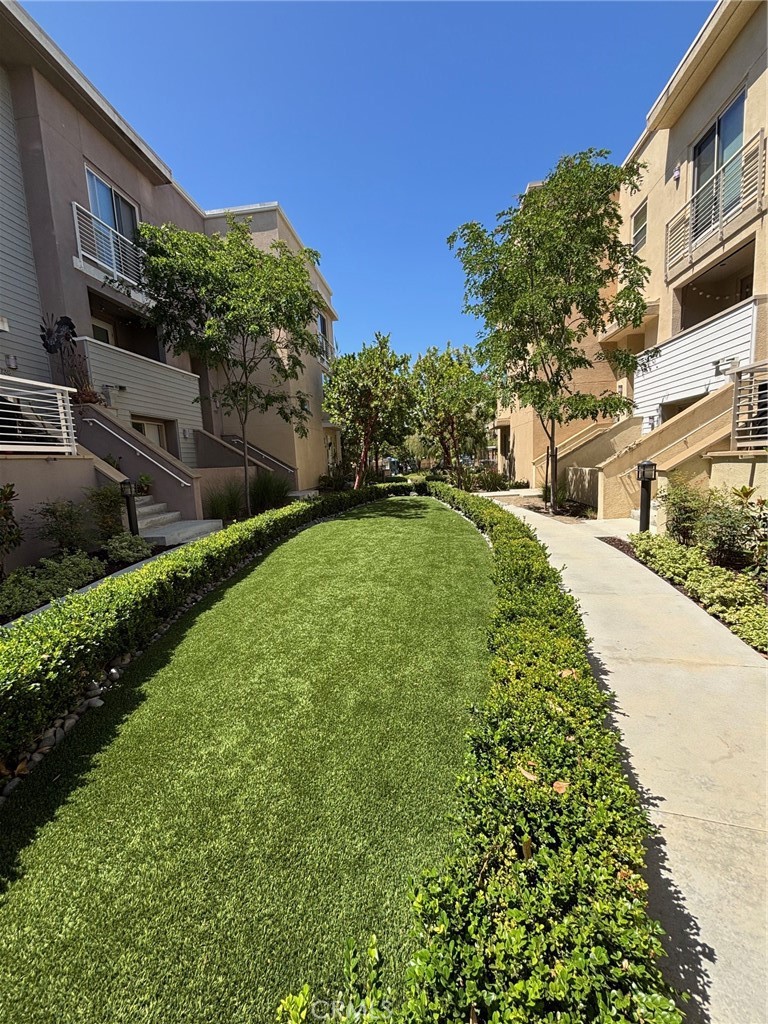 612 East Carson Street, Unit 303 Carson, CA 90745 - Photo 42 of 51 a view of a garden with a house