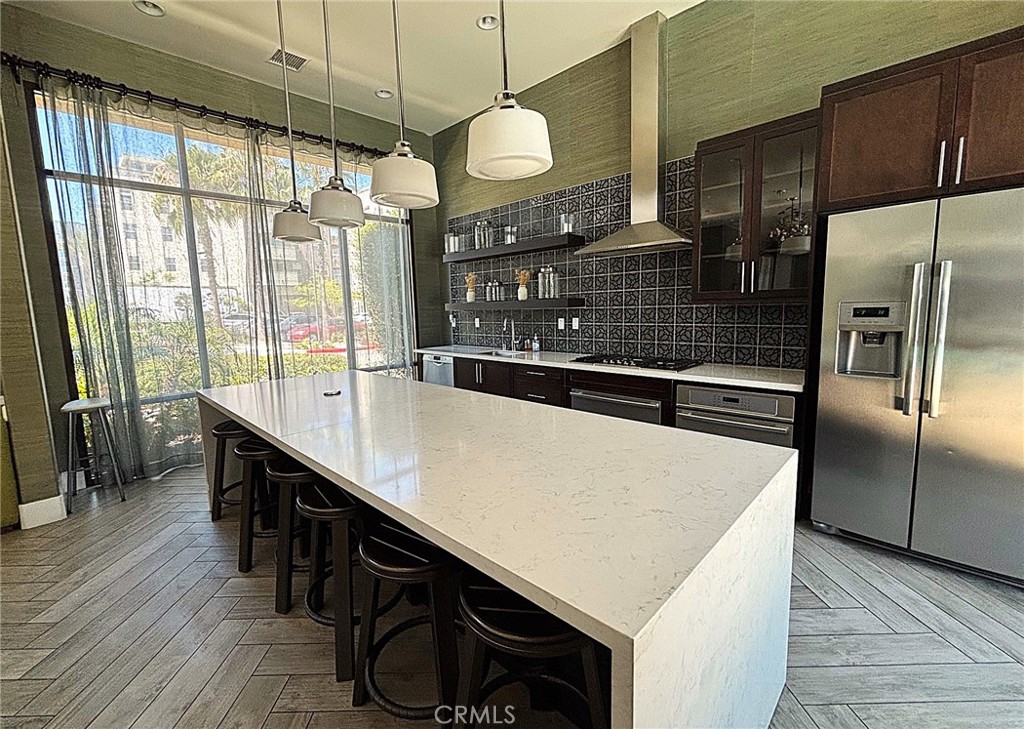 612 East Carson Street, Unit 303 Carson, CA 90745 - Photo 44 of 51 a kitchen with counter top space cabinets and stainless steel appliances