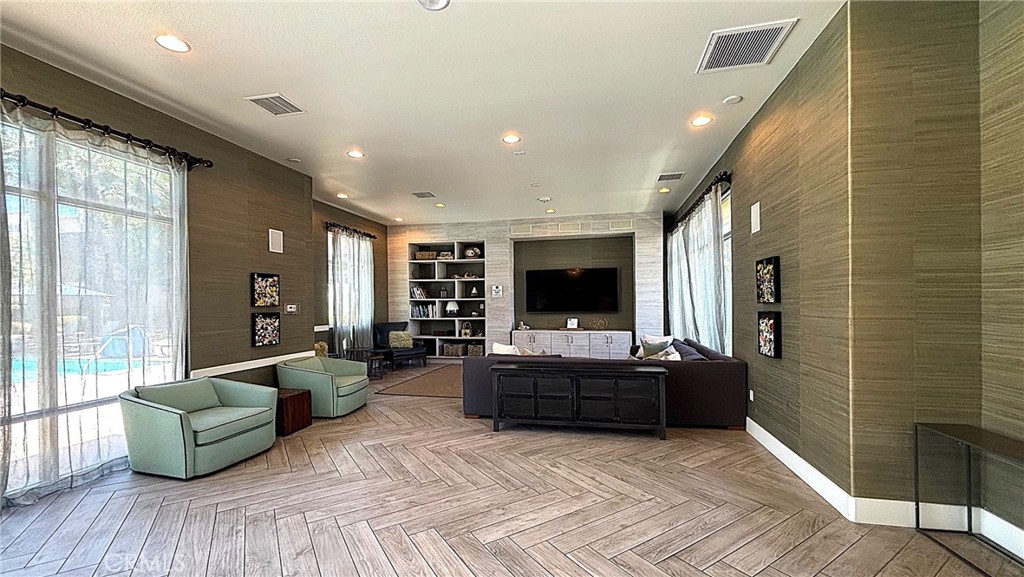 612 East Carson Street, Unit 303 Carson, CA 90745 - Photo 47 of 51 a living room with furniture and a flat screen tv