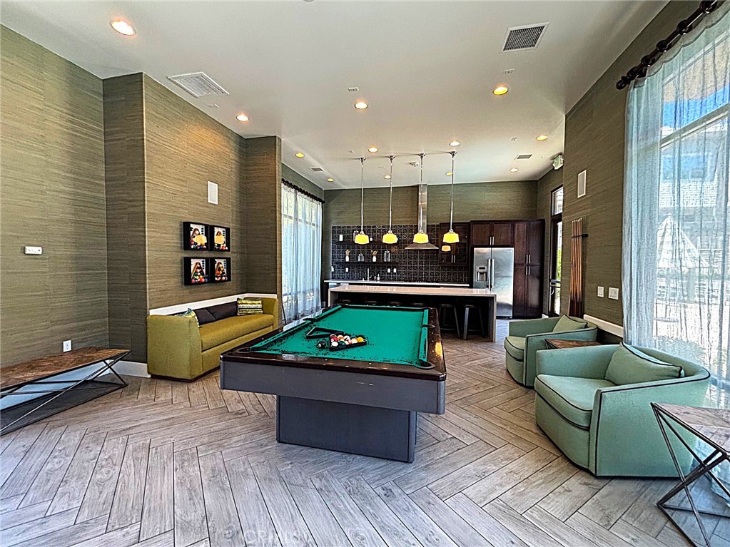 612 East Carson Street, Unit 303 Carson, CA 90745 - Photo 48 of 51 a living room with furniture and a wooden floor