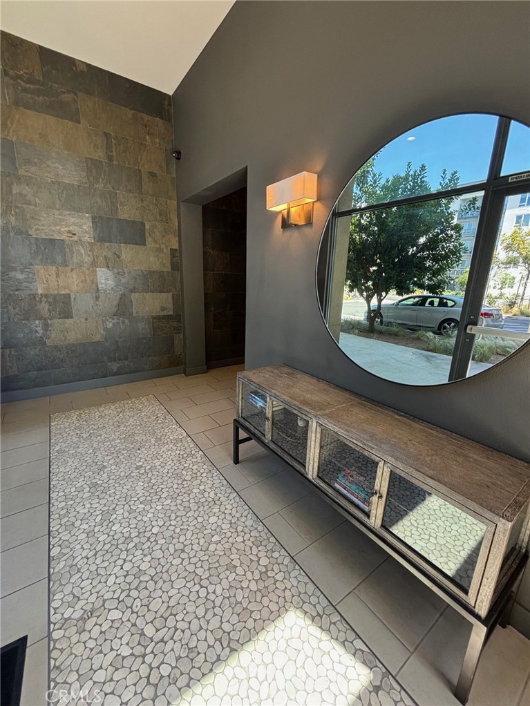 612 East Carson Street, Unit 303 Carson, CA 90745 - Photo 6 of 51 a room with a wooden floor and a table