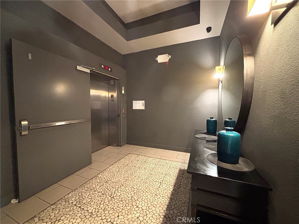 612 East Carson Street, Unit 303 Carson, CA 90745 - Photo 7 of 51 a bathroom with a sink and a mirror