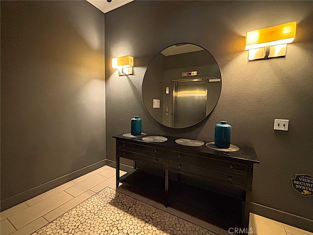 612 East Carson Street, Unit 303 Carson, CA 90745 - Photo 8 of 51 a view of a mirror light fixtures and a window