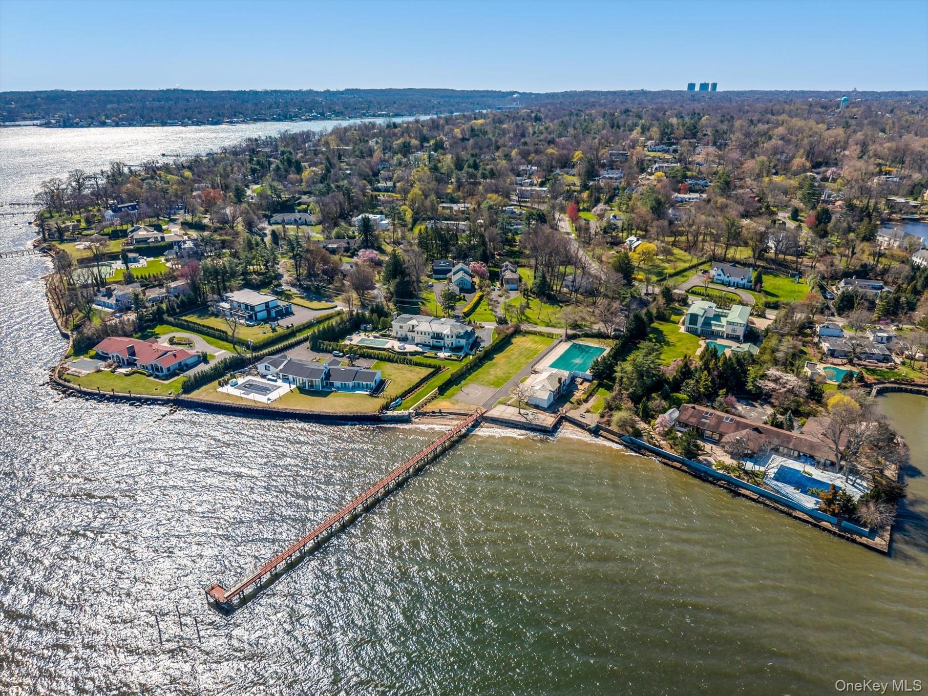 an aerial view of a houses with a ocean view