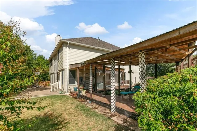 a view of house with patio outdoor seating